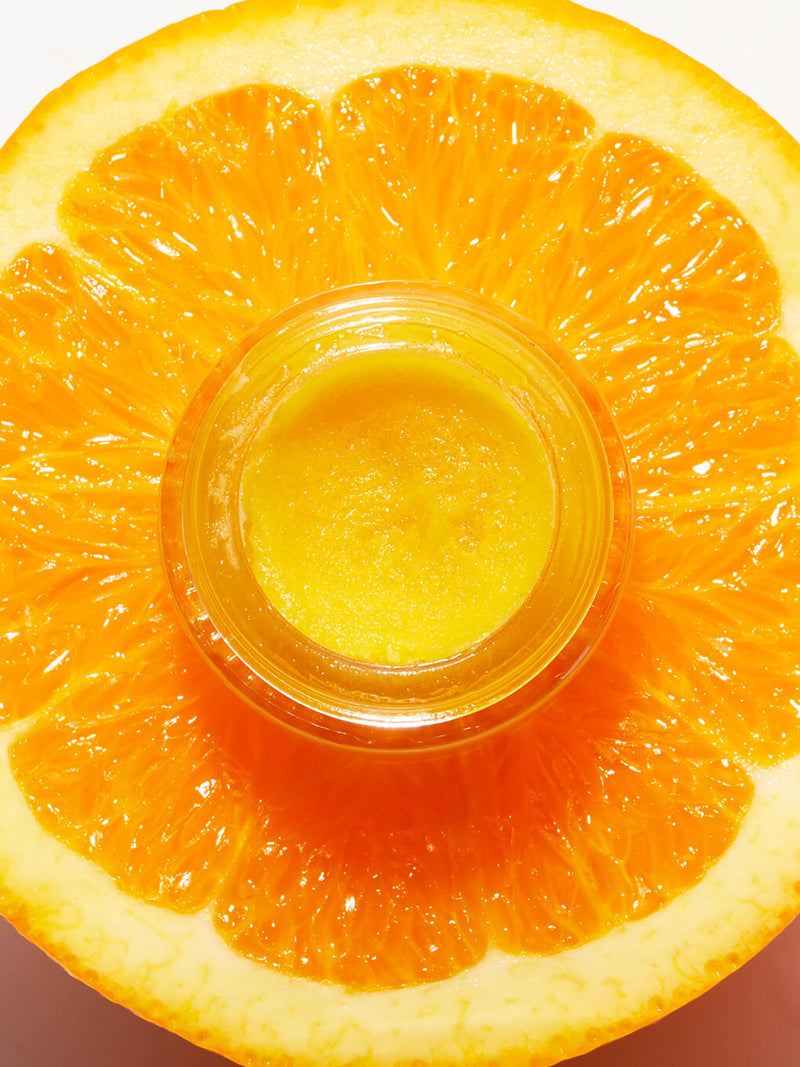 mini orange you bright vitamin c exfoliator on white background with lid on