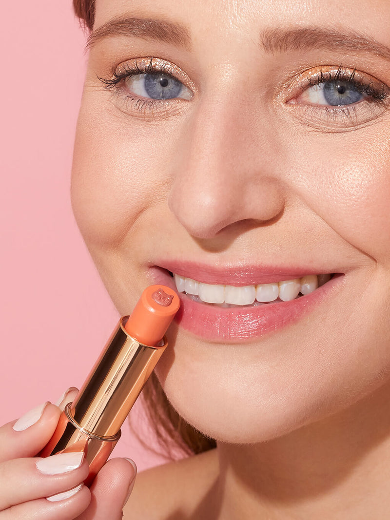 pounce -- purrfect pout sheer lipstick on white background
