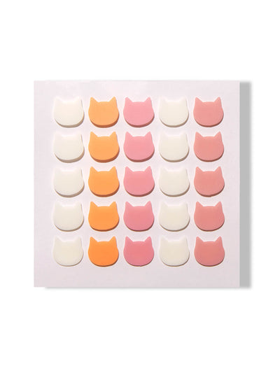 cat shaped pimple patches on white background