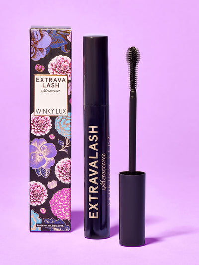 extravalash mascara and box standing with purple background