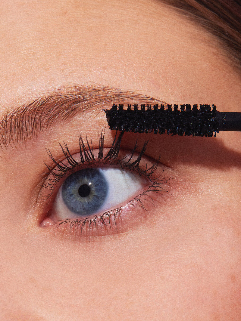mini so extra volumizing mascara on white background