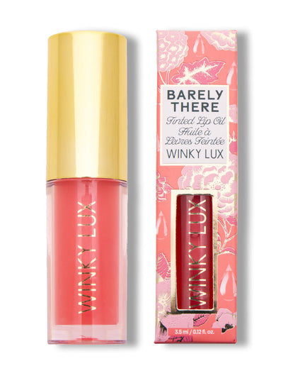 peach whisper -- peach lip oil with cap on next to box on white background