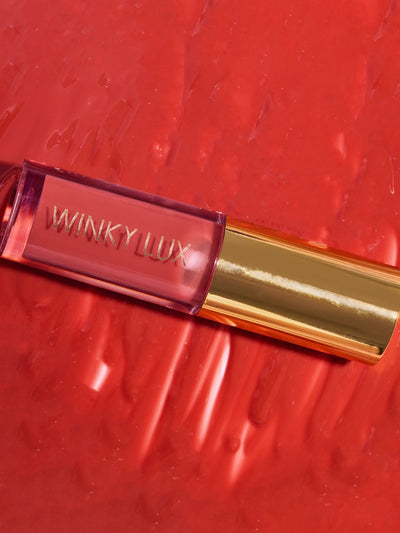 swoon -- close up of lip oil component lying on top of lip oil goop