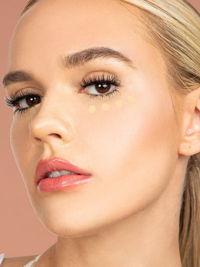 Neutral Beige -- close up of peeper perfect under eye concealer swatch on model