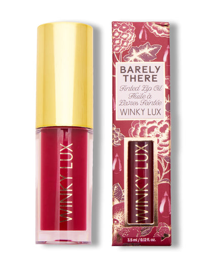 crave -- deep pink lip oil with cap on next to box on white background